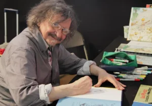 Marc Wasterlain à sa table de dessin