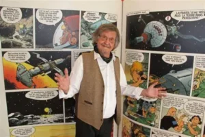 Marc Wasterlain devant une exposition de ses planches